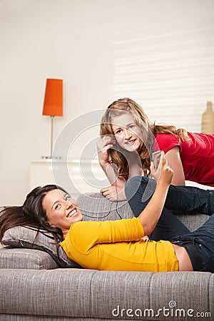 Teen girls listening to music at home Stock Photo