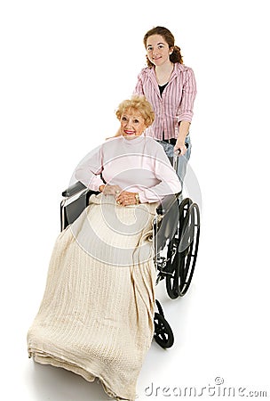 Teen Helps Disabled Senior Stock Photo
