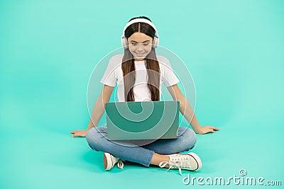 teen influencer blogging. happy girl in headphones. webinar in wireless headset. modern education. Stock Photo