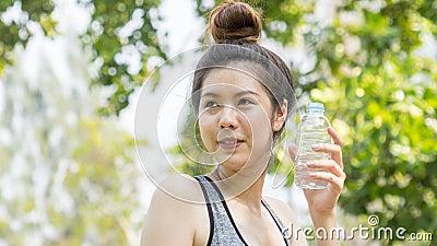 Teen lady hold plastic bottle of water Stock Photo
