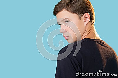 teen lifestyle skeptic attitude insecure frown guy Stock Photo