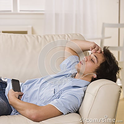 Teen listening to ipod Stock Photo