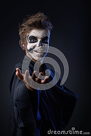 Teen with makeup skull showing indicates Stock Photo