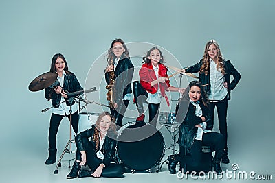 The teen music band performing in a recording studio Stock Photo