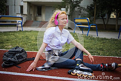 Teen Music And Happy Mood. Adolescent Music In Headphones. Cheerful Happy Girl Outdoor. Stock Photo