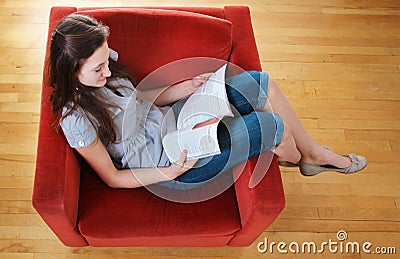 Teen reading a magazine Stock Photo