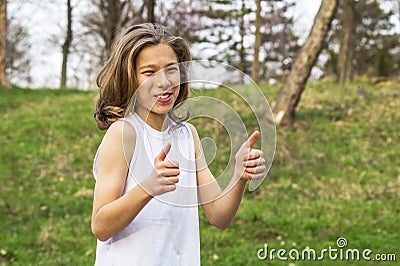 Teen sportsman showing ok sign Stock Photo