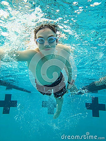Teen swimming freestyle Stock Photo