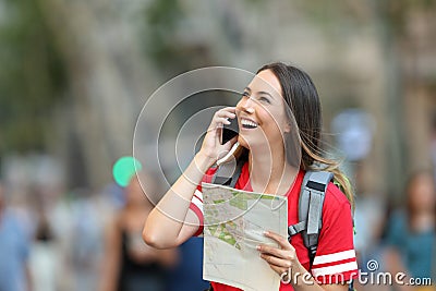 Teen tourist calling on phone in the street Stock Photo