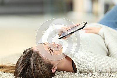 Teen using voice recognition on phone dictating message Stock Photo