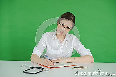 Teen writing in journal Stock Photo