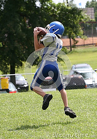 Teen Youth Football Catching Ball Stock Photo