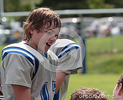 Teen Youth Football Talking with Teammates Stock Photo