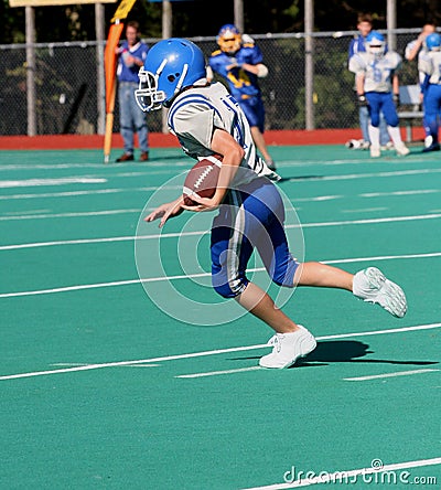 Teen Youth Running With Football Stock Photo