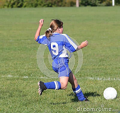 Teen Youth Soccer Kicking Ball Stock Photo