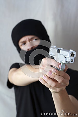 Teenage armed robber Stock Photo