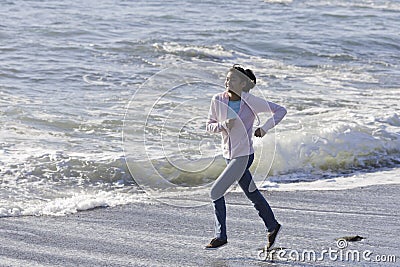 Teenage Asian Girl at Beach Stock Photo