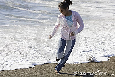 Teenage Asian Girl at Beach Stock Photo