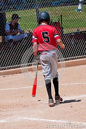 Teenage baseball player from behind. Stock Photo