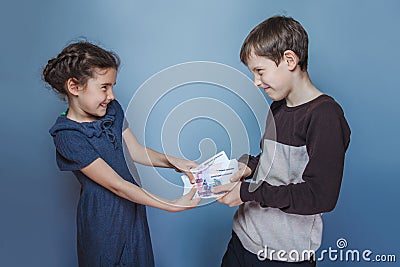 Teenage boy and girl holding money bills in his Stock Photo