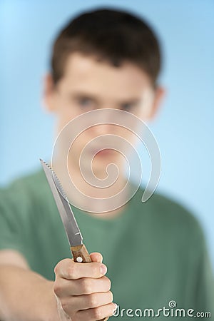 Teenage Boy Holding Knife Stock Photo