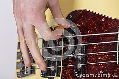 Teenage boy playing base guitarr - bass Stock Photo