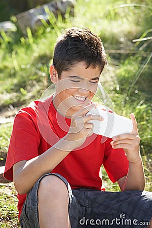 Teenage boy playing with computer game Stock Photo