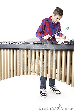 Teenage boy playing marimba in studio Stock Photo