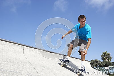 Teenage Boy In Skateboard Park Stock Photo