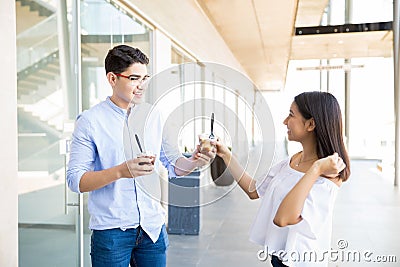 Couple Enjoying Loving Moment With Icecreams In Shopping Mall Stock Photo