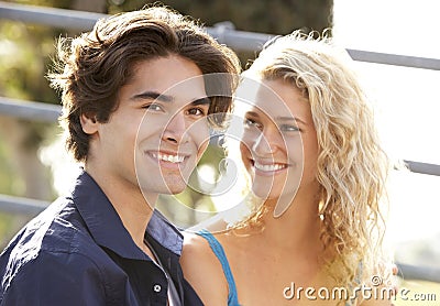 Teenage Couple Sitting On Steps Stock Photo