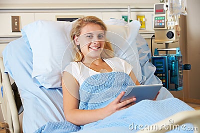 Teenage Female Patient Relaxing In Hospital Bed Stock Photo