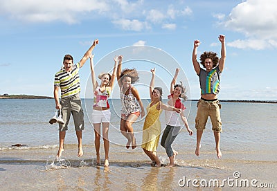 Teenage Friends Having Fun On Beach Stock Photo