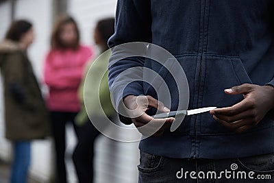 Teenage Gang Armed With Knife Stock Photo