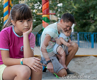 Teenage girl annoyed with her family Stock Photo