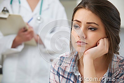 Teenage Girl With Appointment At Doctor's Surgery Stock Photo