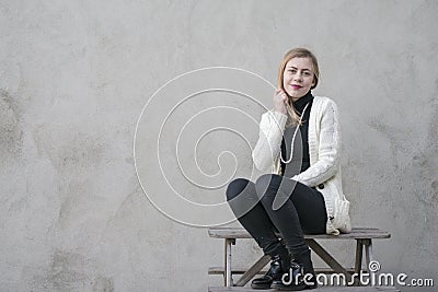 Teenage girl with black neck high pullover Stock Photo