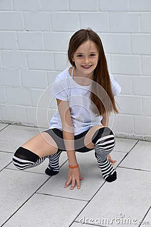 Teenage Girl Crouching Stock Image | CartoonDealer.com #72560113