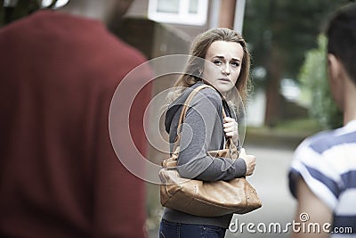 Teenage Girl Feeling Intimidated As She Walks Home Stock Photo