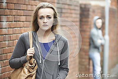 Teenage Girl Feeling Intimidated As She Walks Home Stock Photo