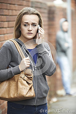 Teenage Girl Feeling Intimidated As She Walks Home Stock Photo