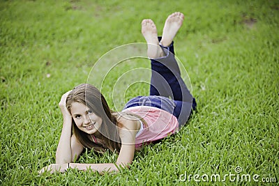 Teenage Girl Female on Grass Stock Photo