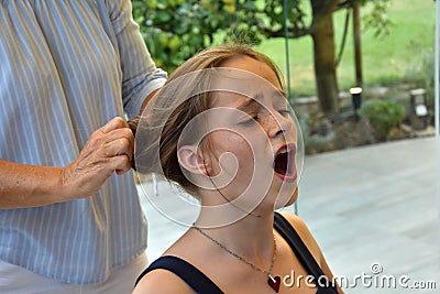 Teenage girl gets a new hairstyle Stock Photo