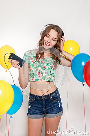 Teenage girl with helium balloons over gray background Stock Photo