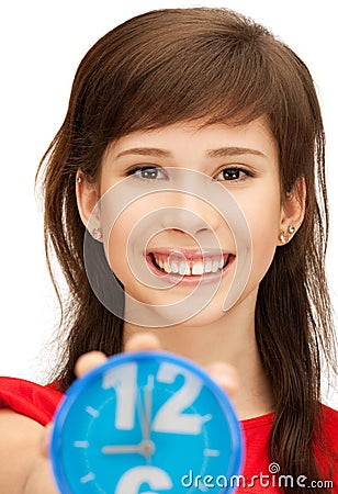 Teenage girl holding alarm clock Stock Photo