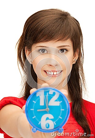 Teenage girl holding alarm clock Stock Photo