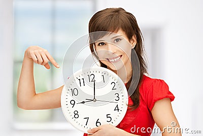 Teenage girl holding big clock Stock Photo