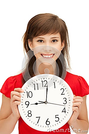 Teenage girl holding big clock Stock Photo