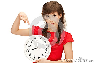 Teenage girl holding big clock Stock Photo