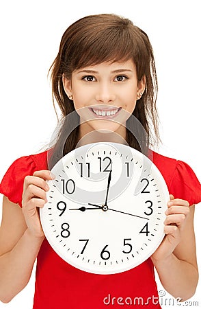 Teenage girl holding big clock Stock Photo